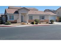 Charming single-story home featuring a well-kept front yard and attached two car garage at 4718 Victoria Garden Ave, North Las Vegas, NV 89031