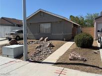 Charming single-story home featuring a concrete walkway and low maintenance desert landscaping at 6766 Sebring St, Las Vegas, NV 89103