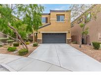 Charming two-story home with a well-maintained front yard and long driveway leading to the attached garage at 6788 Sharks Bay Ct, Las Vegas, NV 89149
