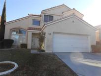 Charming two-story home with a well-maintained front yard and attached two-car garage at 9709 Port Orange Ln, Las Vegas, NV 89134