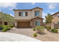 Charming two-story home featuring a two-car garage and a beautifully landscaped front yard at 9839 Berkley Brook Ct, Las Vegas, NV 89141