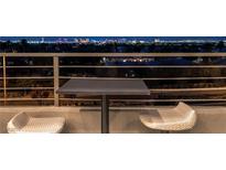 Enjoy the scenic Las Vegas skyline from this home's cozy balcony with comfortable seating at , Las Vegas, NV 89135