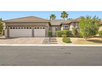 Charming single-story home with a three-car garage and meticulously landscaped front yard at 1314 Doggett Ave, Las Vegas, NV 89123
