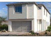 Modern two-story home features a neutral color palette, a two car garage, and large windows at 1543 Pacific Baza St, Las Vegas, NV 89138