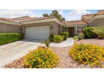 Charming single-story home featuring a well-manicured front yard and a two-car garage at 1912 Summer Pine Ct # 102, Las Vegas, NV 89134