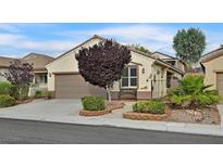 Charming single-story home with a well-manicured front yard and neutral color palette at 2328 Fossil Canyon Dr, Henderson, NV 89052