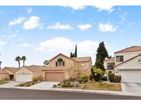 Charming two-story home with a well-manicured front yard and a two-car garage in a quiet neighborhood at 3217 Harbor Vista St, Las Vegas, NV 89117