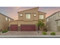 Inviting two-story home featuring a three-car garage and well-manicured landscaping, blending style with practicality at 4039 Beech Fern Ave, North Las Vegas, NV 89084
