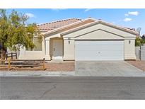 Charming single-story home with a well-maintained yard and attached two-car garage at 5307 Wild Orchid St, North Las Vegas, NV 89031