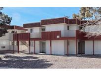 Apartment building showcasing balconies, brown roofing, and tan paint for a stylish and modern living space at 5404 Swenson St # 34, Las Vegas, NV 89119