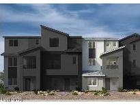 Modern three-story townhome showcasing a sleek architectural design and neutral color palette at 5870 Kips Bay St, Las Vegas, NV 89148