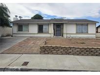 Charming single-story home with brick accents and a well-maintained front yard at 6500 Hill View Ave, Las Vegas, NV 89107