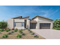 Modern, single-story home with a desert landscape, brick accents and a three car garage at 213 Dolce Viale Ct, Henderson, NV 89011