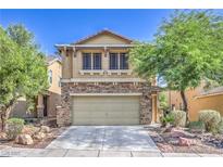 Charming two-story home with a stone facade and well-maintained front yard at 10072 Pelham Park Ave, Las Vegas, NV 89148