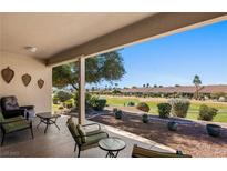 Inviting covered patio with views of the golf course and desert landscaping at 1187 Mohave Dr, Mesquite, NV 89027