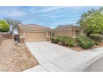 Charming single-story home with a well-maintained lawn and a two-car garage at 2056 Bay Thrush Way, North Las Vegas, NV 89084