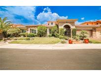 Beautiful single-story home with a well-manicured lawn and desert landscaping at 213 Villa Borghese St, Las Vegas, NV 89138