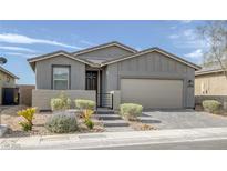 Charming single story home with a well maintained xeriscaped front yard at 2395 Arrington Ave, North Las Vegas, NV 89086