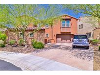 Charming two-story home with a beautiful brick driveway and well-maintained landscaping at 2497 Birch Hollow St, Henderson, NV 89044