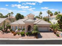 Charming single-story home with a well-manicured front yard, driveway, and two-car garage at 277 Dark Forest Ave, Las Vegas, NV 89123
