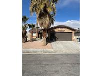 Charming single-story home with desert landscaping and a two-car garage at 3710 Royal Fern Cir, Las Vegas, NV 89115