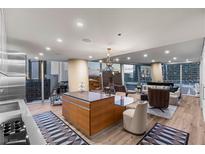 Bright, open-concept living room and kitchen with modern finishes and city views at 3726 Las Vegas Blvd # 606, Las Vegas, NV 89158