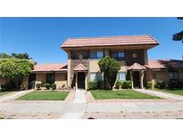 Charming townhome featuring a well-maintained lawn and desert-friendly landscaping at 4310 Lynnann Dr, Las Vegas, NV 89110