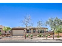 Charming single-story home featuring desert landscaping and a spacious two-car garage at 508 Cadence View Way, Henderson, NV 89011