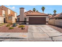 Charming single-story home with a two-car garage and desert landscaping at 5725 Cedar Ave, Las Vegas, NV 89110