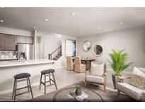 Bright living room features open floor plan, dining area, and access to the kitchen at 620 Bellus Pl # Lot 168, Henderson, NV 89015