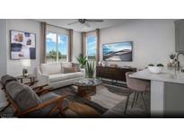 Bright living room with modern decor, neutral colors, and a large window providing ample natural light at 620 Bellus Pl # Lot 168, Henderson, NV 89015
