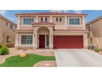 Two-story home with a red roof, red garage doors, and manicured lawn at 6558 Musette Ave, Las Vegas, NV 89139
