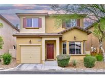 Charming two-story home showcasing a well-maintained front yard, warm exterior tones and inviting curb appeal at 6739 Twisted Wood Dr, Las Vegas, NV 89148