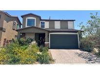 Two-story home with a two-car garage and well-manicured landscaping at 7732 Bandon Cliffs St, North Las Vegas, NV 89084