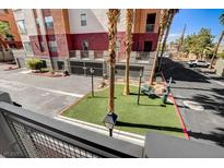 Charming exterior view with manicured landscaping and building architecture at 83 E Agate Ave # 207, Las Vegas, NV 89123