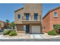 Charming two-story home featuring a private balcony and a one-car garage at 9431 Mad Dog St, Las Vegas, NV 89178