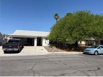 Charming single-story home with a well-maintained front yard and mature trees at , Las Vegas, NV 89110