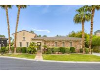 Elegant single-story home featuring lush landscaping, a gated entrance and desert-friendly design at 10156 Kearney Hill Pl, Las Vegas, NV 89144