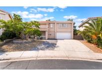 Charming two-story home featuring a well-maintained front yard and a spacious driveway at 2874 Avanti Ln, Henderson, NV 89074