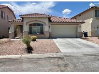 Charming single-story home with a two-car garage and low-maintenance desert landscaping at 3261 Monaco Shores Dr, Las Vegas, NV 89117