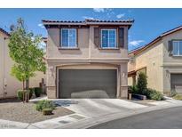 Charming two-story home with a two-car garage and desert landscaping at 3839 Zodiacal Light St, Las Vegas, NV 89129