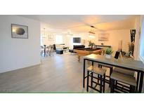 Spacious living room featuring a pool table, dining area, and modern decor at 6432 Bannock Way, Las Vegas, NV 89107