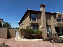 Charming two-story townhouse with desert landscaping and inviting walkway at 682 Corte Madera Ave, Henderson, NV 89015