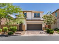 Charming two-story home with a neatly landscaped front yard and two-car garage at 7194 Sage Wren Ct, Las Vegas, NV 89148