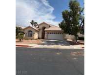 Charming single-story home with a tile roof and a well-maintained front yard with desert landscaping at 110 Eagleview Ct, Henderson, NV 89074