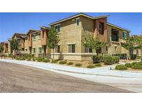 Inviting townhomes feature landscaped yards, neutral exteriors, and convenient walkways at 12282 Azure Gate Rd # 4, Las Vegas, NV 89183