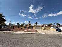 Charming single-story home with a well-maintained yard and a convenient attached garage at 1590 Raindance Way, Las Vegas, NV 89169
