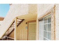 Exterior shot of building with stair case leading to door and windows at 1851 Hillpointe Rd # 1711, Henderson, NV 89074