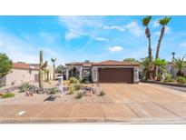 Charming single story home with desert landscaping, sidewalk, and beautiful front yard appeal at 444 Viewmont Dr, Henderson, NV 89015