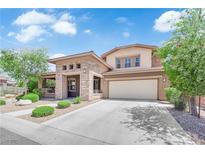 Stunning two-story home with a beautifully landscaped front yard and a two-car garage at 5542 Oak Bend Dr, Las Vegas, NV 89135